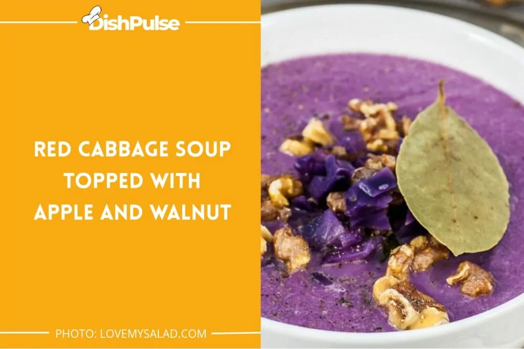 Red cabbage soup topped with apple and walnut